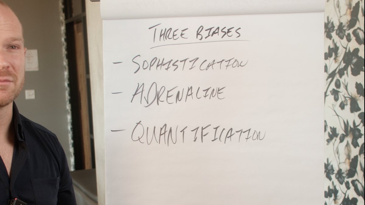 Flip chart listing all three biases: Sophistication, Adrenaline, Quantification